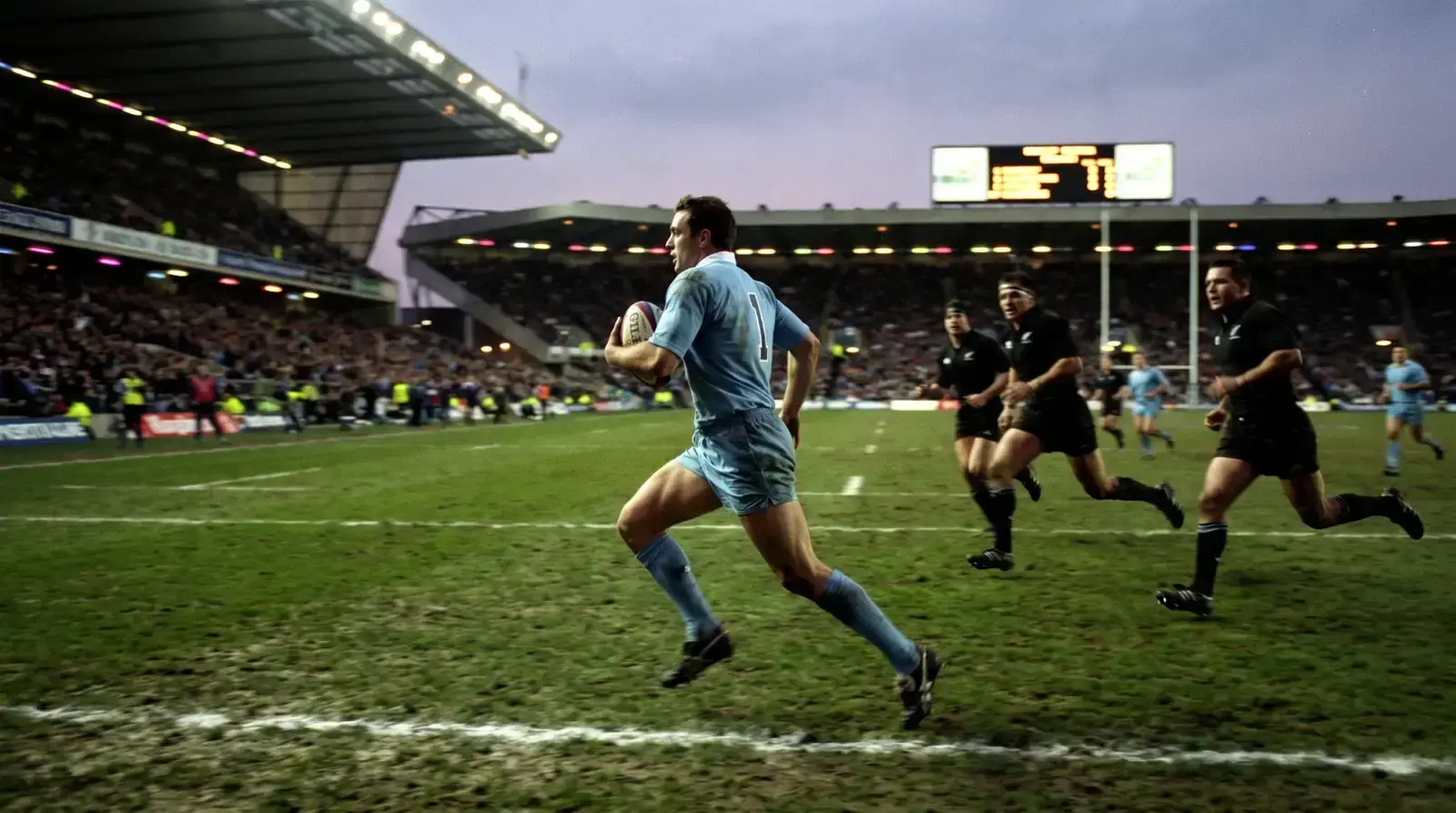 NRL fullback running the ball back from a kick return