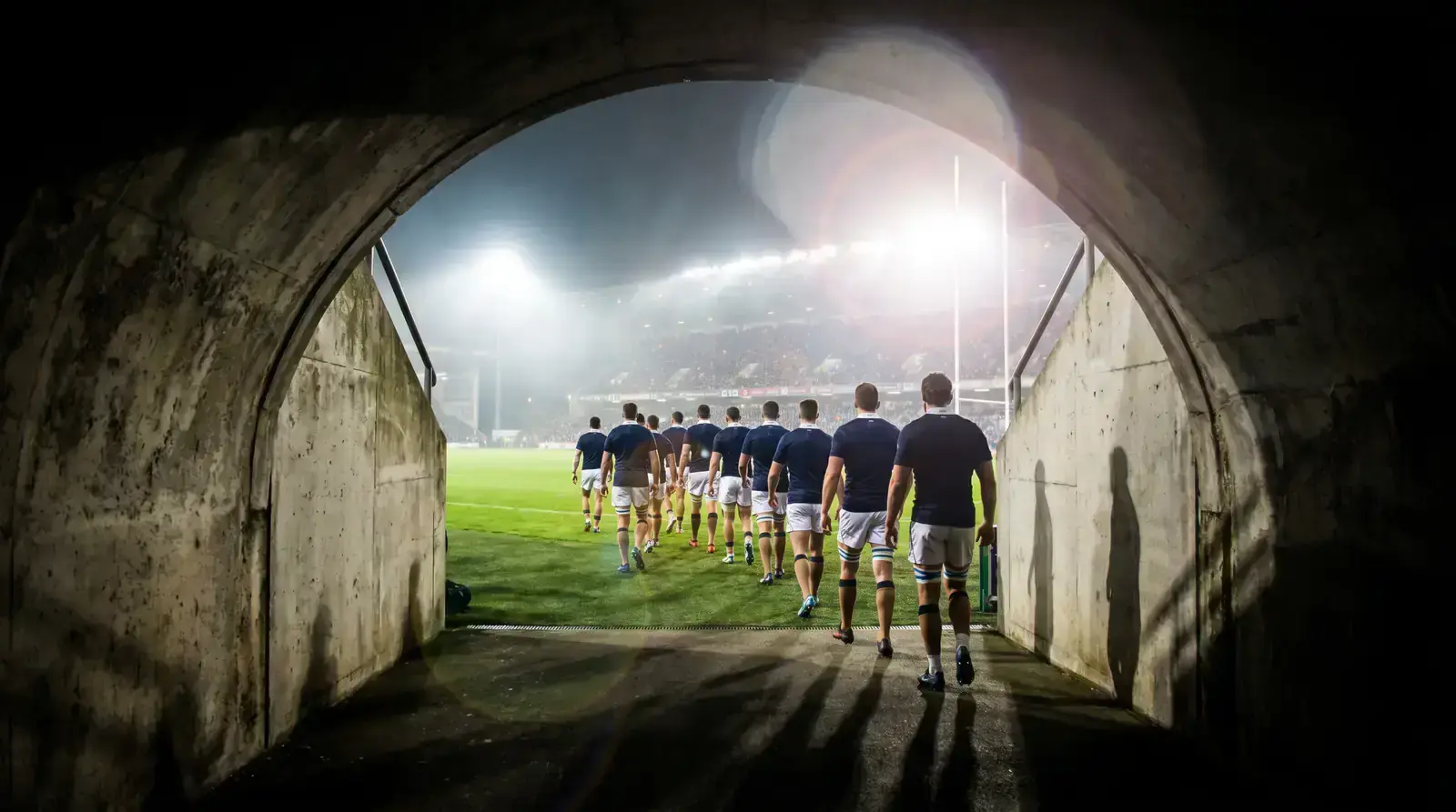 Stadium tunnel view of rugby players walking out before kick-off