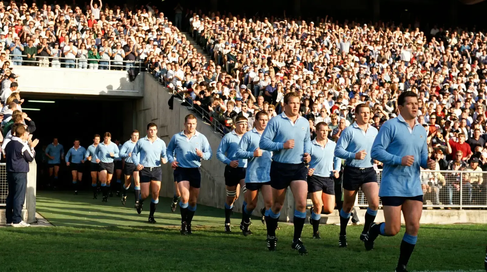 Touring rugby team running out at a major Southern Hemisphere stadium
