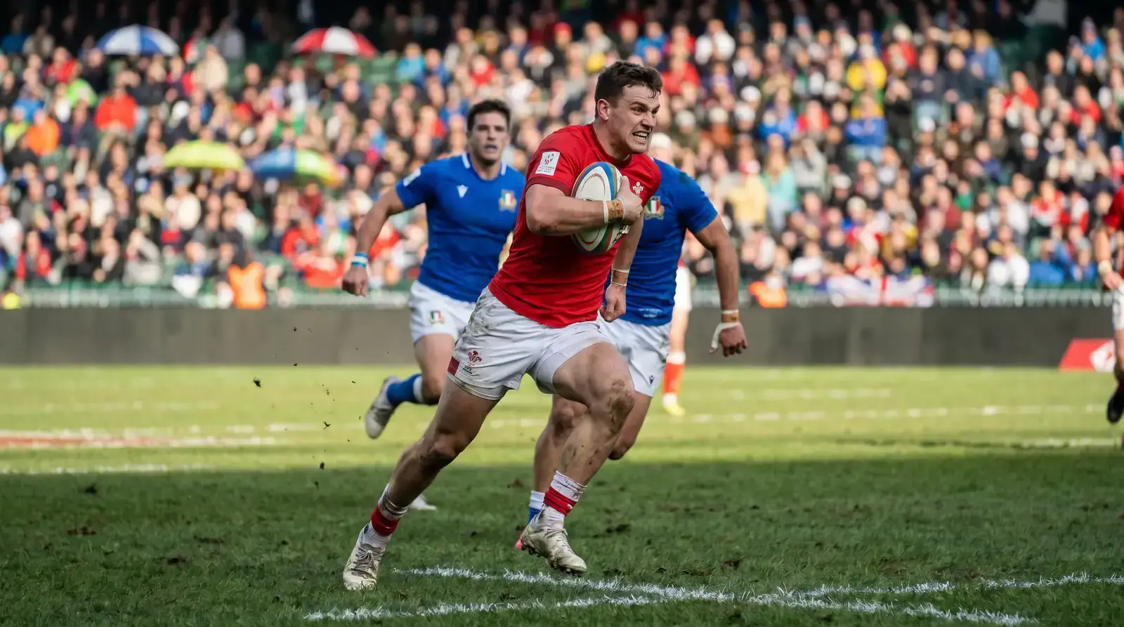 Rugby sevens player breaking through the defensive line during an international tournament fixture