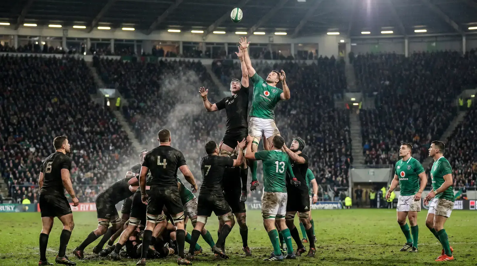 Rugby World Cup style international match in a full stadium under floodlights