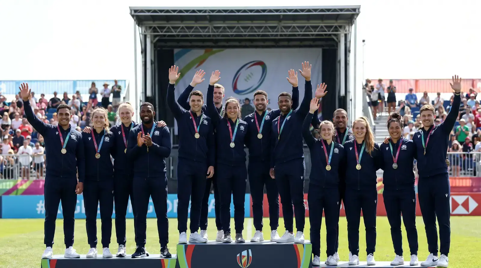 Sevens rugby medal ceremony scene with players on a podium