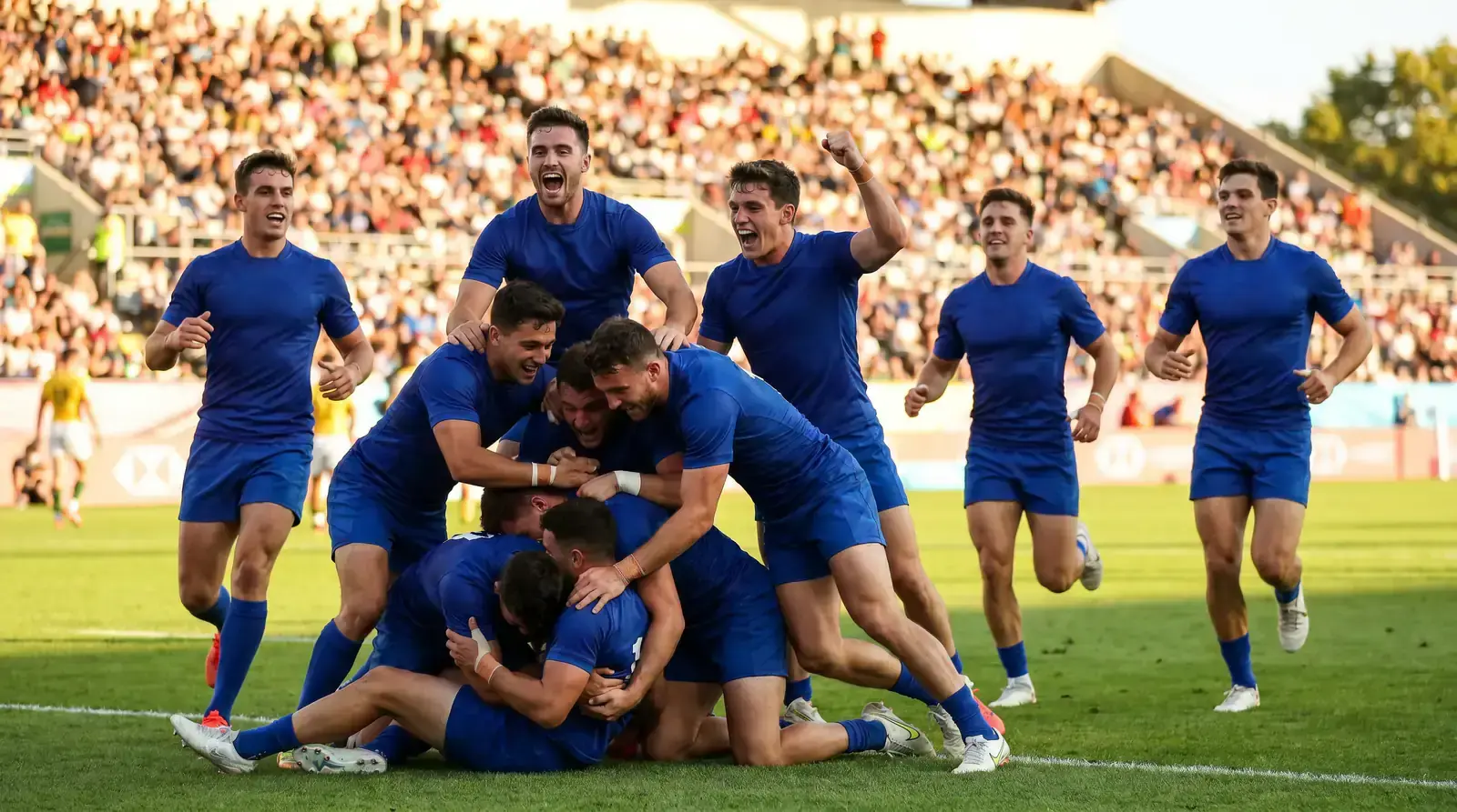 Final-second try in a sevens match with players celebrating