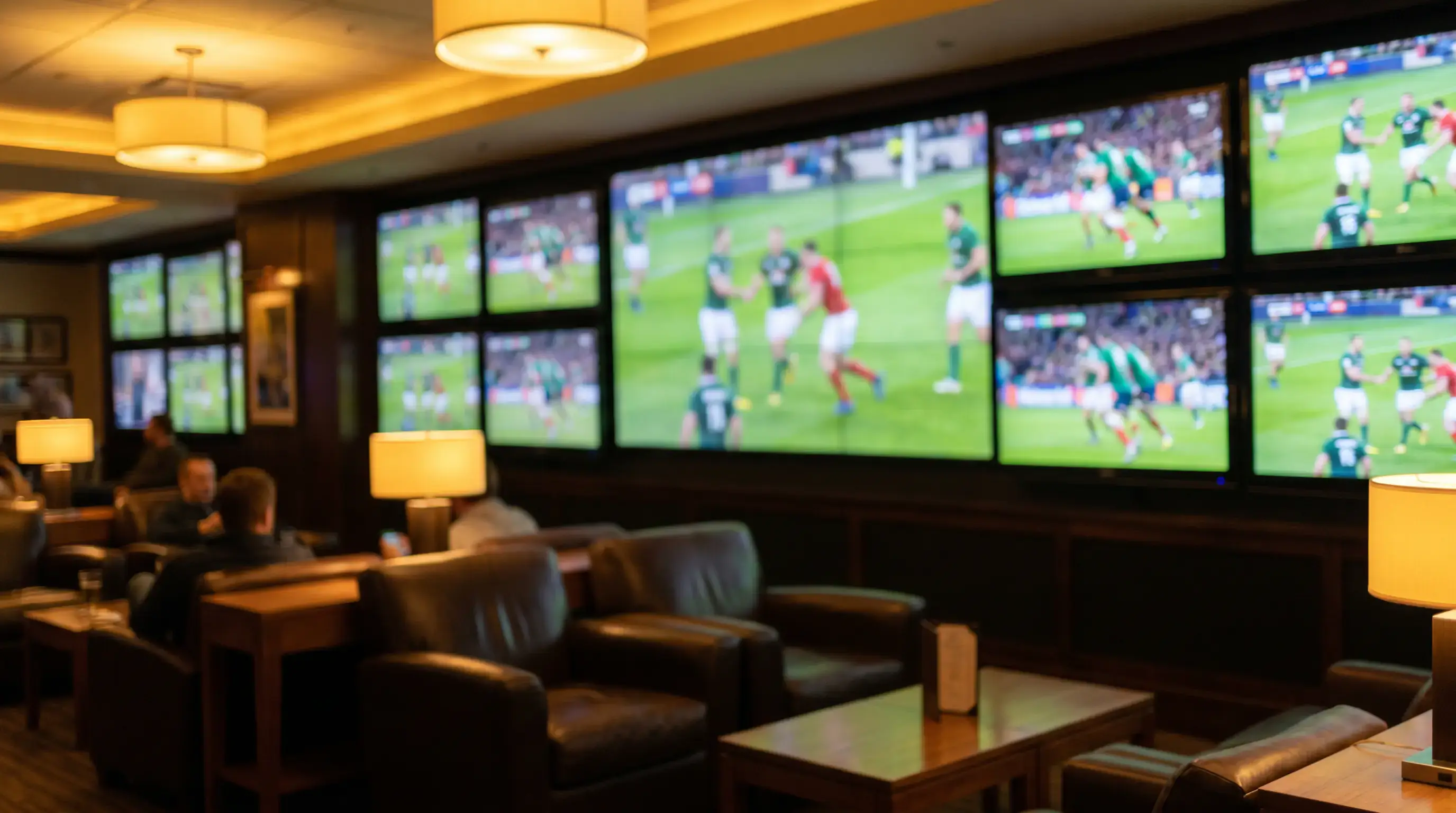 Multi-screen wall showing generic rugby content in a sportsbook